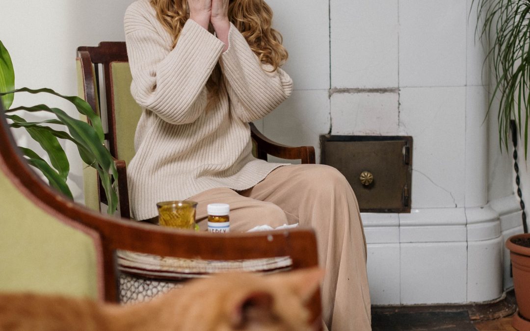 Woman sneezing into a tissue during a seasonal allergy flare-up